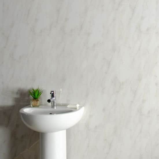 White pedestal sink with a small plant against a marble wall_10mm Storm Grey Marble Gloss Shower Panel 1M x 2.4M