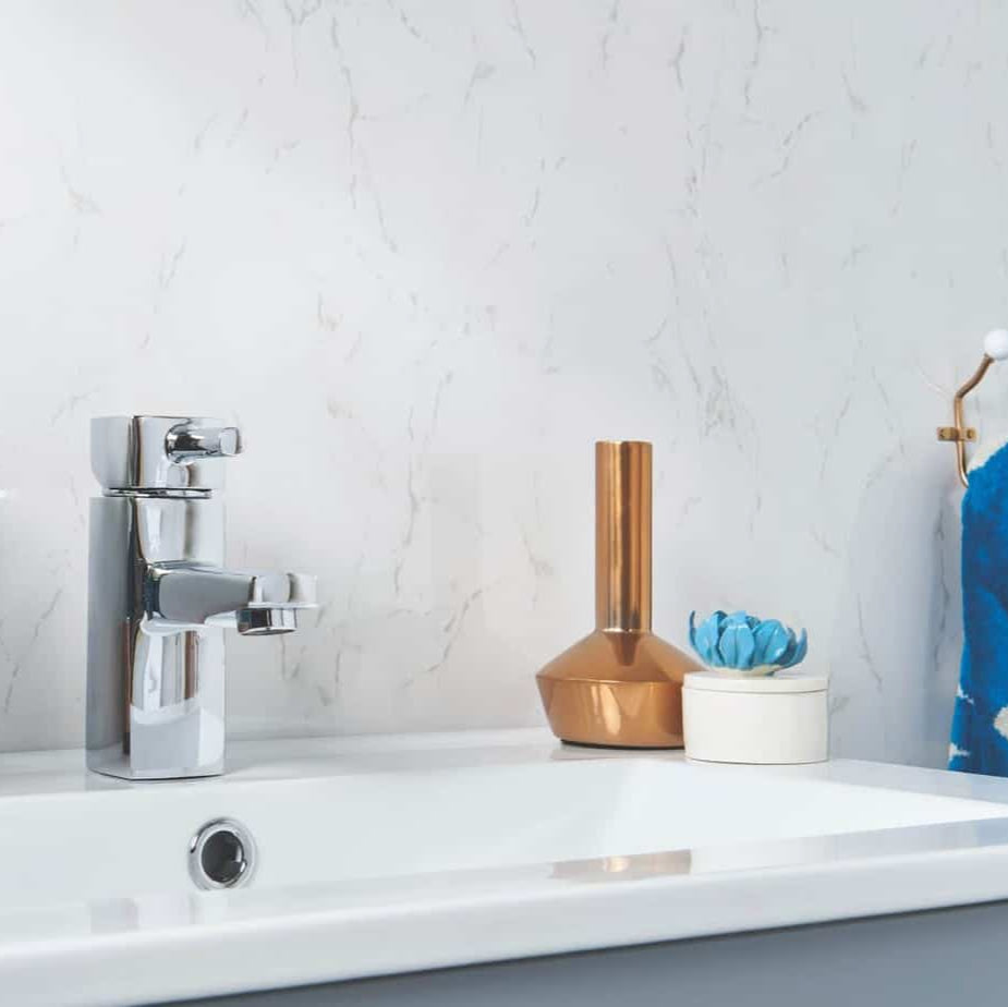 Bathroom sink with faucet, decorative vase, and small plant against a light gray wall
_10mm Storm Grey Marble Gloss Shower Panel 1M x 2.4M