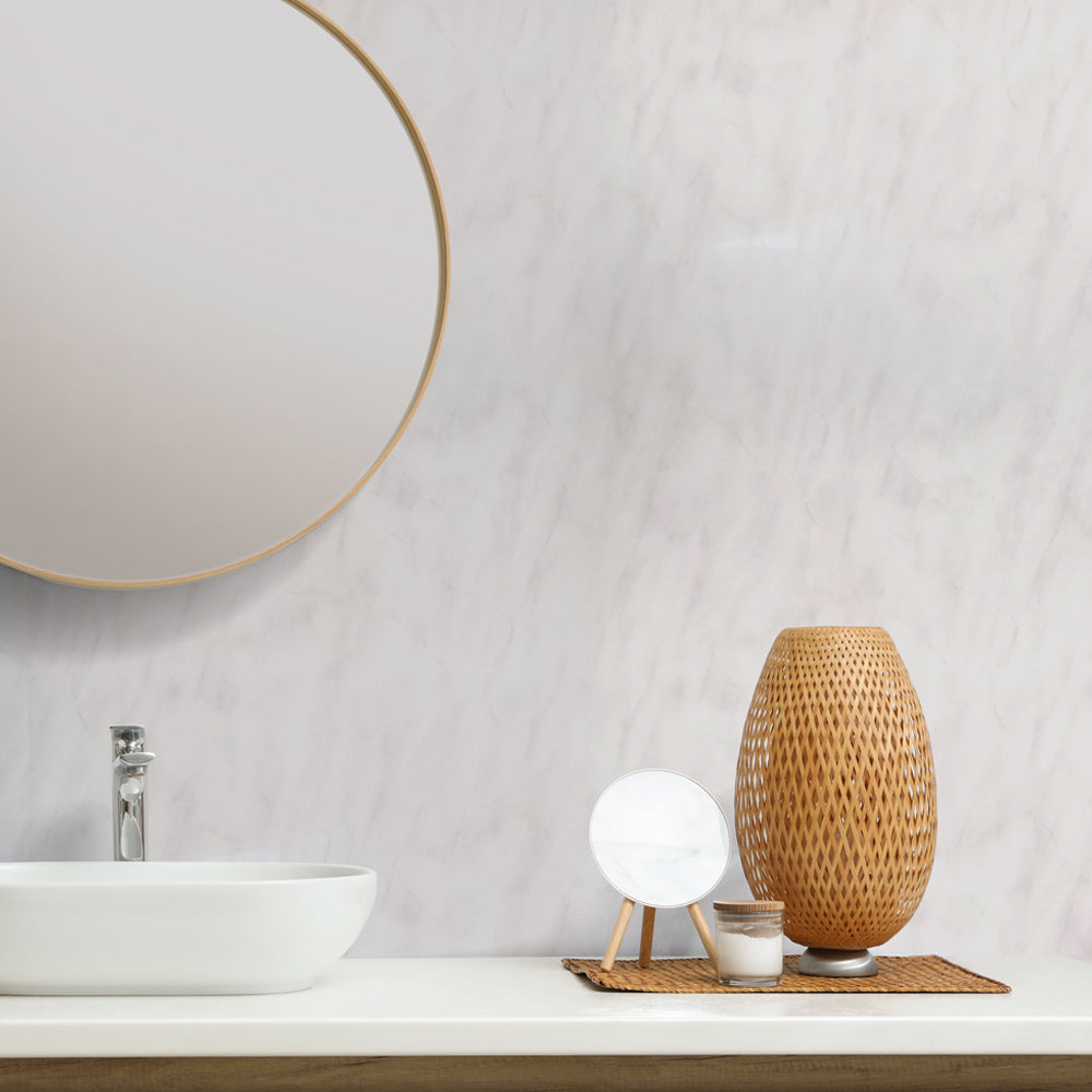 Bathroom counter with a round mirror, sink, and decorative items including a woven vase and small lamp_10mm Storm Grey Marble Gloss Shower Panel 1M x 2.4M